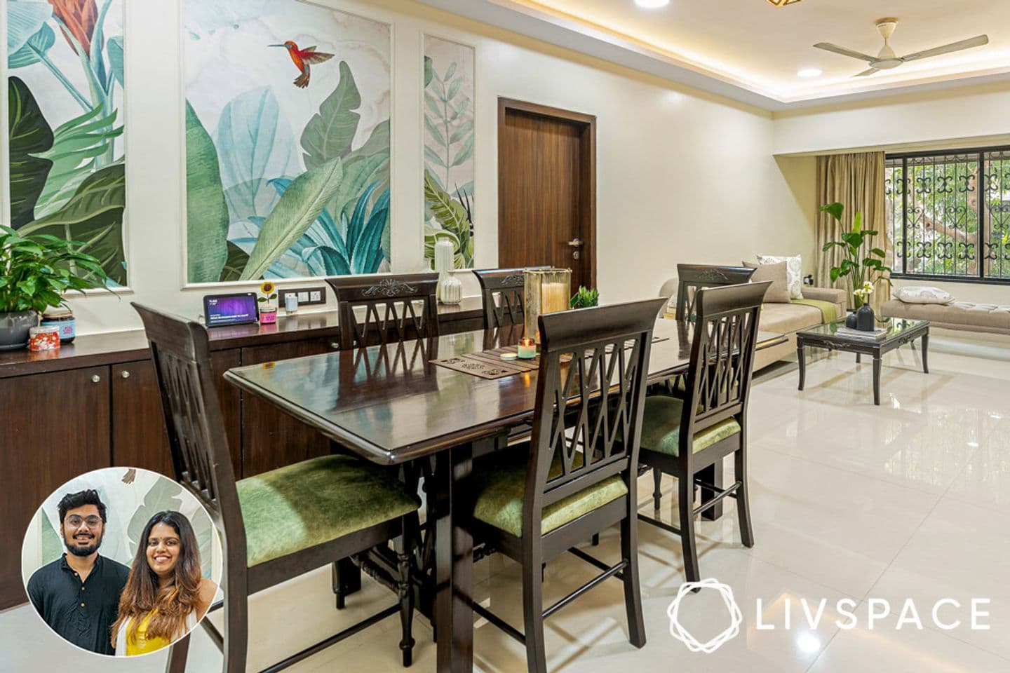 Polished dining table and upholstered chairs in front of a tropical artwork framed by wall trims